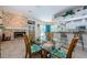 Open concept living space featuring dining area, kitchen and fireplace at 4452 Bardsdale Dr, Palm Harbor, FL 34685