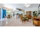 Open living concept dining area with view of kitchen and other seating areas at 4452 Bardsdale Dr, Palm Harbor, FL 34685