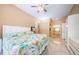 Spacious main bedroom featuring tiled floors, a closet, and en-suite bathroom at 4452 Bardsdale Dr, Palm Harbor, FL 34685
