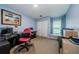 Comfortable home office with a desk and chair, a bright window, and closet space at 4452 Bardsdale Dr, Palm Harbor, FL 34685