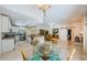 Spacious open floor plan featuring the kitchen, dining area, and easy access to living spaces at 4452 Bardsdale Dr, Palm Harbor, FL 34685