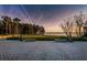 Inviting park view with paved area, benches, and a glimpse of the water, perfect for relaxation and enjoying nature at 4452 Bardsdale Dr, Palm Harbor, FL 34685