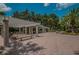 Outdoor pavilion area with ample seating and a view of the landscaped surroundings creates a tranquil community space at 4452 Bardsdale Dr, Palm Harbor, FL 34685