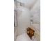 Modern shower features geometric tile work, dual shower heads, and built in storage at 4452 Bardsdale Dr, Palm Harbor, FL 34685