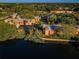 Aerial view of a lakeside community with lush greenery and serene water features at 4805 Alt 19 # 421, Palm Harbor, FL 34683