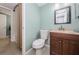 Bathroom features a sink, mirror, toilet, and shower with a curtain at 4805 Alt 19 # 421, Palm Harbor, FL 34683