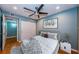 Comfortable bedroom with a ceiling fan, closet, and stylish decorations on display at 4805 Alt 19 # 421, Palm Harbor, FL 34683