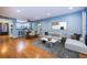 Spacious living area with an open layout, kitchen access, modern furniture, and plenty of light at 4805 Alt 19 # 421, Palm Harbor, FL 34683