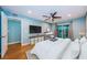 Main bedroom has ceiling fan, wood floor and a sliding glass door to a private balcony at 4805 Alt 19 # 421, Palm Harbor, FL 34683