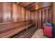 Interior view of a home sauna with wooden benches and paneling for relaxation and wellness at 4805 Alt 19 # 421, Palm Harbor, FL 34683