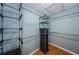 Walk-in closet with metal and black organizers at 4805 Alt 19 # 421, Palm Harbor, FL 34683