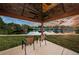 Water view from beneath a gazebo with chairs on a grassy area at 4805 Alt 19 # 421, Palm Harbor, FL 34683