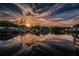 Beautiful lake reflecting the sky with waterfront properties and docks, perfect for tranquil living at 4805 Alt 19 # 421, Palm Harbor, FL 34683