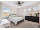 Serene bedroom with minimalist decor, a comfortable bed, and natural light for a peaceful ambiance at 4808 Jackson Club Loop, Tampa, FL 33624