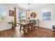 Bright dining area featuring a wood table and chairs, and access to the outdoor patio at 4808 Jackson Club Loop, Tampa, FL 33624
