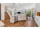 Bright, open kitchen with a view of the dining area and stairs to the upper level at 4808 Jackson Club Loop, Tampa, FL 33624