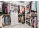 Well-organized walk-in closet with custom shelving and ample storage for clothing and accessories at 4808 Jackson Club Loop, Tampa, FL 33624