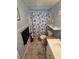 The bathroom featuring a patterned shower curtain and updated fixtures at 4851 W Gandy Blvd # B3L12, Tampa, FL 33611