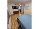Comfortable bedroom features hardwood floors, a flat screen TV, and a dresser at 4851 W Gandy Blvd # B3L12, Tampa, FL 33611