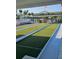 Well-kept bocce ball courts available for residents, landscaped with palms at 4851 W Gandy Blvd # B3L12, Tampa, FL 33611