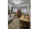 Cozy eat-in kitchen featuring tile flooring and a full suite of appliances at 4851 W Gandy Blvd # B3L12, Tampa, FL 33611