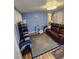 This living room is cozy with a sofa, rug, and a lamp at 4851 W Gandy Blvd # B3L12, Tampa, FL 33611