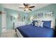 Brightly decorated bedroom features seaside accents and cool blue bedding at 5157 Silent Loop # 214, New Port Richey, FL 34652