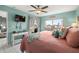 Well-lit bedroom boasts a private balcony and coastal-themed accessories at 5157 Silent Loop # 214, New Port Richey, FL 34652