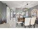 Dining area with stylish table and chairs, open to the living room at 5157 Silent Loop # 214, New Port Richey, FL 34652