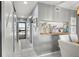 Hallway with a view into the kitchen and dining area, featuring coastal decorations at 5157 Silent Loop # 214, New Port Richey, FL 34652