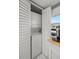 Laundry closet with stacked washer and dryer at 5157 Silent Loop # 214, New Port Richey, FL 34652