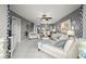 Spacious living room with view of the dining area and white furnishings at 5157 Silent Loop # 214, New Port Richey, FL 34652
