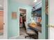 Charming small office with a desk, chair, and adjacent walk-in closet at 5157 Silent Loop # 214, New Port Richey, FL 34652