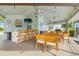 Enjoy the outdoor area with ceiling fans, a kitchen area, and comfortable seating at the bar or tables at 5157 Silent Loop # 214, New Port Richey, FL 34652