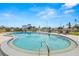 Community pool with views of boats and buildings on the waterfront at 5157 Silent Loop # 214, New Port Richey, FL 34652