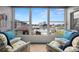 Inviting sunroom featuring comfortable seating and a picturesque view of the pool, waterway, and harbor at 5157 Silent Loop # 214, New Port Richey, FL 34652