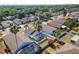 Aerial view of a lush backyard with a screened-in pool, bordered by a white privacy fence at 518 Royal Ridge St, Valrico, FL 33594