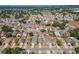 Overhead view of a charming residential neighborhood featuring tree-lined streets and well-kept lawns at 518 Royal Ridge St, Valrico, FL 33594