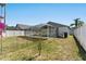 Large backyard featuring a screened-in pool enclosure, great for outdoor living and entertaining at 518 Royal Ridge St, Valrico, FL 33594