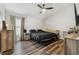 Comfortable bedroom with hardwood floors, a large window, and neutral decor at 518 Royal Ridge St, Valrico, FL 33594