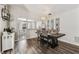 Bright dining area with wood floors, pendant lighting, and a seamless transition to the kitchen at 518 Royal Ridge St, Valrico, FL 33594