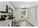 Modern kitchen boasting stainless steel appliances, white cabinets, and ample counter space at 518 Royal Ridge St, Valrico, FL 33594