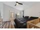 Spacious main bedroom with wood-look floors, ceiling fan, and ensuite bathroom access at 518 Royal Ridge St, Valrico, FL 33594