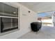 Covered patio with grill area and view of the sparkling pool at 518 Royal Ridge St, Valrico, FL 33594