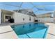 Backyard pool with screened enclosure and patio area perfect for outdoor entertaining at 518 Royal Ridge St, Valrico, FL 33594