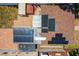 This aerial image highlights the home's unique roof, with solar panels, an outdoor spa and privacy fence at 5324 3Rd N Ave, St Petersburg, FL 33710