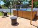 Outdoor living space features an outdoor kitchen area with grill, pergola, hot tub, and fire pit at 5324 3Rd N Ave, St Petersburg, FL 33710