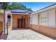 Backyard brick patio with hot tub, privacy screen, and solar panels at 5324 3Rd N Ave, St Petersburg, FL 33710