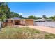 Expansive backyard with patio, solar panels, privacy fence, and lush landscaping at 5324 3Rd N Ave, St Petersburg, FL 33710