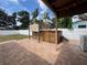 Backyard features a private hot tub with pergola on a brick patio with tropical landscaping at 5324 3Rd N Ave, St Petersburg, FL 33710